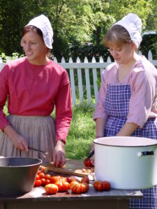 girls dressed in pioneer clothing