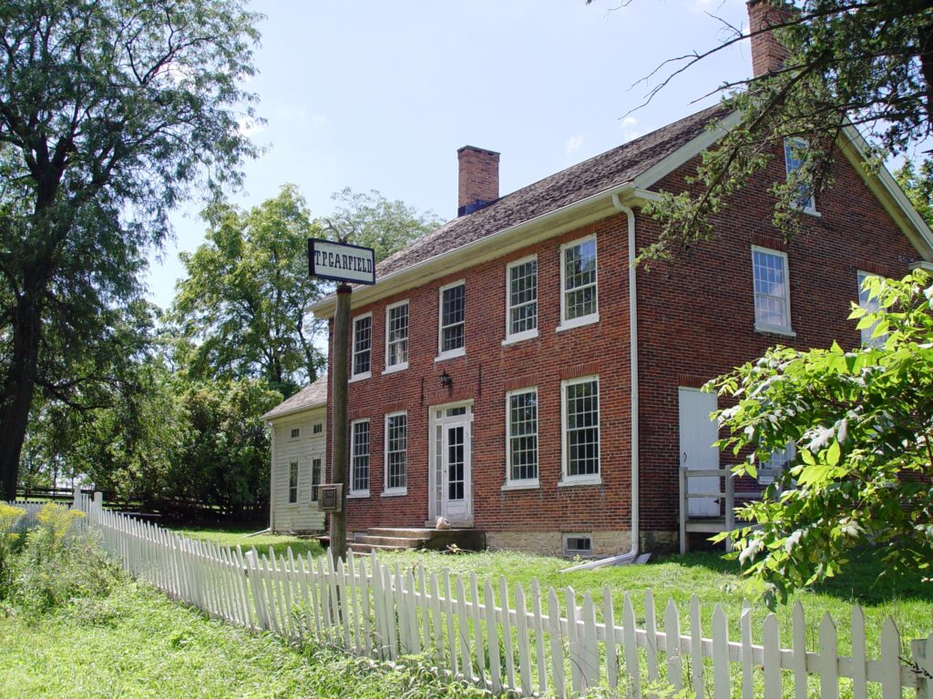 farmhouse with picket fence